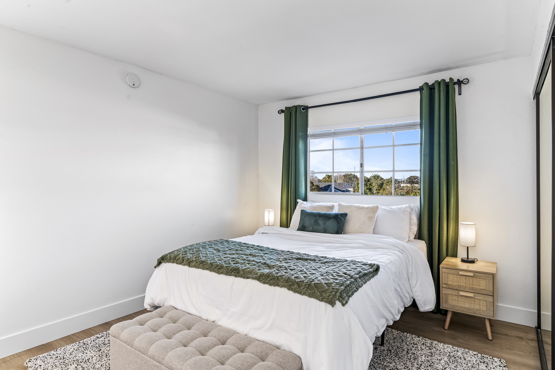 Comfortable bedroom with greenery